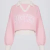 Bawełniany sweter oversize z dekoltem w serek w kolorze pudrowego różu Bawełniany sweter oversize z dekoltem w serek w kolorze pudrowego różu