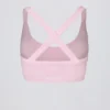 Bezszwowy biustonosz sportowy Super Sculpt z krzyżującymi się na plecach ramiączkami w kolorze pudrowego różu Bezszwowy biustonosz sportowy Super Sculpt z krzyżującymi się na plecach ramiączkami w kolorze pudrowego różu