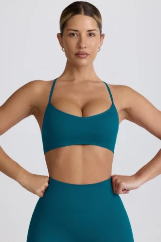 Bezszwowy biustonosz sportowy Super Sculpt z krzyżującymi się na plecach ramiączkami w kolorze turkusowym Bezszwowy biustonosz sportowy Super Sculpt z krzyżującymi się na plecach ramiączkami w kolorze turkusowym