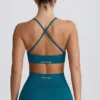 Bezszwowy biustonosz sportowy Super Sculpt z krzyżującymi się na plecach ramiączkami w kolorze turkusowym Bezszwowy biustonosz sportowy Super Sculpt z krzyżującymi się na plecach ramiączkami w kolorze turkusowym