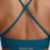 Bezszwowy biustonosz sportowy Super Sculpt z krzyżującymi się na plecach ramiączkami w kolorze turkusowym Bezszwowy biustonosz sportowy Super Sculpt z krzyżującymi się na plecach ramiączkami w kolorze turkusowym