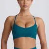 Bezszwowy biustonosz sportowy Super Sculpt z krzyżującymi się na plecach ramiączkami w kolorze turkusowym Bezszwowy biustonosz sportowy Super Sculpt z krzyżującymi się na plecach ramiączkami w kolorze turkusowym