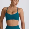 Bezszwowy biustonosz sportowy Super Sculpt z krzyżującymi się na plecach ramiączkami w kolorze turkusowym Bezszwowy biustonosz sportowy Super Sculpt z krzyżującymi się na plecach ramiączkami w kolorze turkusowym