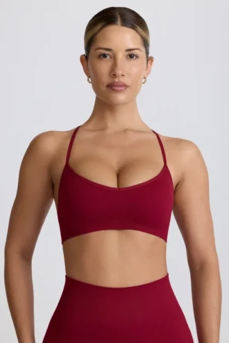 Bezszwowy biustonosz sportowy Super Sculpt z krzyżującymi się ramiączkami na plecach w kolorze bordowym Bezszwowy biustonosz sportowy Super Sculpt z krzyżującymi się ramiączkami na plecach w kolorze bordowym