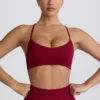 Bezszwowy biustonosz sportowy Super Sculpt z krzyżującymi się ramiączkami na plecach w kolorze bordowym Bezszwowy biustonosz sportowy Super Sculpt z krzyżującymi się ramiączkami na plecach w kolorze bordowym