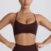 Bezszwowy biustonosz sportowy Super Sculpt z krzyżującymi się ramiączkami na plecach w kolorze czekoladowym Bezszwowy biustonosz sportowy Super Sculpt z krzyżującymi się ramiączkami na plecach w kolorze czekoladowym