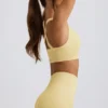 Bezszwowy biustonosz sportowy Super Sculpt z krzyżującymi się ramiączkami w kolorze maślanożółtym Bezszwowy biustonosz sportowy Super Sculpt z krzyżującymi się ramiączkami w kolorze maślanożółtym