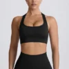 Bezszwowy biustonosz sportowy Super Sculpt z tyłem w kształcie litery T w kolorze czarnym Bezszwowy biustonosz sportowy Super Sculpt z tyłem w kształcie litery T w kolorze czarnym