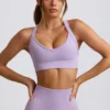 Bezszwowy stanik sportowy Super Sculpt z krzyżującymi się ramiączkami na plecach w kolorze delikatnego bzu Bezszwowy stanik sportowy Super Sculpt z krzyżującymi się ramiączkami na plecach w kolorze delikatnego bzu