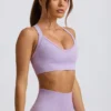 Bezszwowy stanik sportowy Super Sculpt z krzyżującymi się ramiączkami na plecach w kolorze delikatnego bzu Bezszwowy stanik sportowy Super Sculpt z krzyżującymi się ramiączkami na plecach w kolorze delikatnego bzu