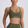 Bezszwowy stanik sportowy Super Sculpt z krzyżującymi się ramiączkami na plecach w kolorze jasnozielonym Bezszwowy stanik sportowy Super Sculpt z krzyżującymi się ramiączkami na plecach w kolorze jasnozielonym
