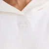 Biała bluza z kapturem z teksturowanego bawełnianego dżerseju z nadrukiem graficznym Biała bluza z kapturem z teksturowanego bawełnianego dżerseju z nadrukiem graficznym