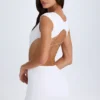 Biała mini sukienka Addison z wycięciami i wiązaniem Biała mini sukienka Addison z wycięciami i wiązaniem