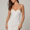 Biała sukienka mini z ozdobami w stylu bandeau o kroju litery A marki Edita Biała sukienka mini z ozdobami w stylu bandeau o kroju litery A marki Edita