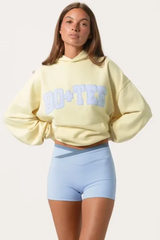 Bluza z kapturem oversize z aplikacją w kolorze cytrynowym Bluza z kapturem oversize z aplikacją w kolorze cytrynowym