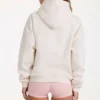 Bluza z kapturem oversize z aplikacją w kolorze kości słoniowej Bluza z kapturem oversize z aplikacją w kolorze kości słoniowej