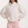 Bluza z kapturem oversize z aplikacją w kolorze kości słoniowej w groszki Bluza z kapturem oversize z aplikacją w kolorze kości słoniowej w groszki