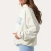 Bluza z kapturem oversize z aplikacją w kolorze mlecznym w kropki Bluza z kapturem oversize z aplikacją w kolorze mlecznym w kropki