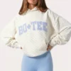 Bluza z kapturem oversize z aplikacją w kolorze mlecznym w kropki Bluza z kapturem oversize z aplikacją w kolorze mlecznym w kropki