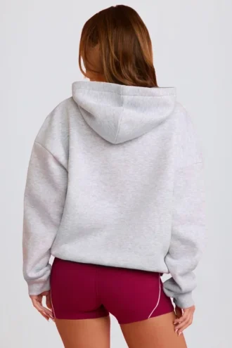 Bluza z kapturem oversize z aplikacją w kolorze szarym Bluza z kapturem oversize z aplikacją w kolorze szarym