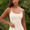 Body z wycięciami w kolorze kremowym Body z wycięciami w kolorze kremowym