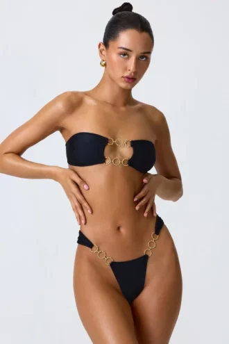 Top bikini bandeau z wycięciami i zdobieniami Sunny Isles w kolorze czarnym Top bikini bandeau z wycięciami i zdobieniami Sunny Isles w kolorze czarnym