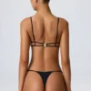 Czarny top bikini Sanibel z wycięciami i łańcuszkami Czarny top bikini Sanibel z wycięciami i łańcuszkami
