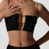 Czarny top z wycięciami i zdobieniami Ariana Czarny top z wycięciami i zdobieniami Ariana