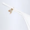 Doły od bikini Cebu Charm – figi stringowe z detalami w kolorze białym Doły od bikini Cebu Charm – figi stringowe z detalami w kolorze białym