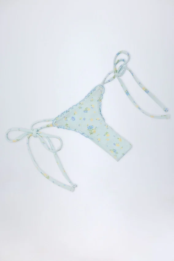 Doły od bikini Nieva z wiązaniem z boku w niebieski kwiatowy wzór Doły od bikini Nieva z wiązaniem z boku w niebieski kwiatowy wzór