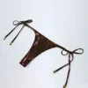Doły od bikini typu stringi Tierra w kolorze brązowo-złotym Doły od bikini typu stringi Tierra w kolorze brązowo-złotym