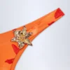 Fioletowe doły od bikini Beqa z metalowymi detalami w pomarańczowo-orchideowy wzór