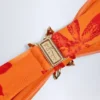 Góra bikini z wiązaniem na szyi i metalowymi detalami Baracoa w pomarańczowy wzór orchidei