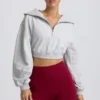 Krótka bluza z zamkiem 1/4 w kolorze szarym melanżowym Krótka bluza z zamkiem 1/4 w kolorze szarym melanżowym