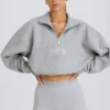 Krótka bluza z zamkiem 1/4 w kolorze szarym melanżowym Krótka bluza z zamkiem 1/4 w kolorze szarym melanżowym
