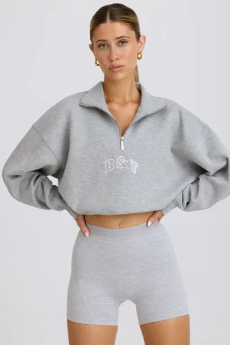 Krótka bluza z zamkiem 1/4 w kolorze szarym melanżowym