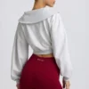 Krótka bluza z zamkiem 1/4 w kolorze szarym melanżowym Krótka bluza z zamkiem 1/4 w kolorze szarym melanżowym