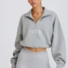 Krótka bluza z zamkiem 1/4 w kolorze szarym melanżowym Krótka bluza z zamkiem 1/4 w kolorze szarym melanżowym