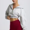 Krótka bluza z zamkiem 1/4 w kolorze szarym melanżowym Krótka bluza z zamkiem 1/4 w kolorze szarym melanżowym
