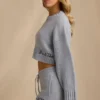 Krótki sweter z dzianiny prążkowanej w kolorze jasnoniebieskim Krótki sweter z dzianiny prążkowanej w kolorze jasnoniebieskim