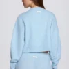 Krótki sweter z dzianiny w kolorze pudrowego błękitu Krótki sweter z dzianiny w kolorze pudrowego błękitu