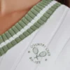 Krótki sweter z dzianiny warkoczowej z bawełny w kolorze zielono-kości słoniowej