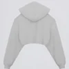 Krótki sweter z kapturem z dzianiny dżersejowej z podszerstkiem w kolorze szarym Krótki sweter z kapturem z dzianiny dżersejowej z podszerstkiem w kolorze szarym