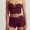 Krótki top bandeau Tarni z metalowymi detalami w kolorze jagodowo-fioletowym Krótki top bandeau Tarni z metalowymi detalami w kolorze jagodowo-fioletowym