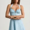 Nerine Sukienka mini z dekoltem halter i krojem w literę A w niebieski kwiatowy wzór Nerine Sukienka mini z dekoltem halter i krojem w literę A w niebieski kwiatowy wzór