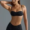 Oh Polly Moda kąpielowa: Top do bikini Micro z ozdobami z serii HOTFIX w kolorze czarnym Oh Polly Moda kąpielowa: Top do bikini Micro z ozdobami z serii HOTFIX w kolorze czarnym