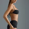 Oh Polly Moda kąpielowa: Top do bikini Micro z ozdobami z serii HOTFIX w kolorze czarnym Oh Polly Moda kąpielowa: Top do bikini Micro z ozdobami z serii HOTFIX w kolorze czarnym
