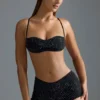 Oh Polly Moda kąpielowa: Top do bikini Micro z ozdobami z serii HOTFIX w kolorze czarnym Oh Polly Moda kąpielowa: Top do bikini Micro z ozdobami z serii HOTFIX w kolorze czarnym