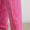 Spodnie dresowe oversize z dzianiny szczotkowanej w kolorze gorącego różu Spodnie dresowe oversize z dzianiny szczotkowanej w kolorze gorącego różu
