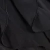 Spodnie Felicity z falbanami, średnim stanem i rozkloszowanym krojem w kolorze czarnym Spodnie Felicity z falbanami, średnim stanem i rozkloszowanym krojem w kolorze czarnym